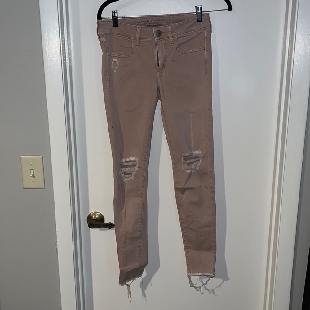 Light pink distressed denim. US size 2